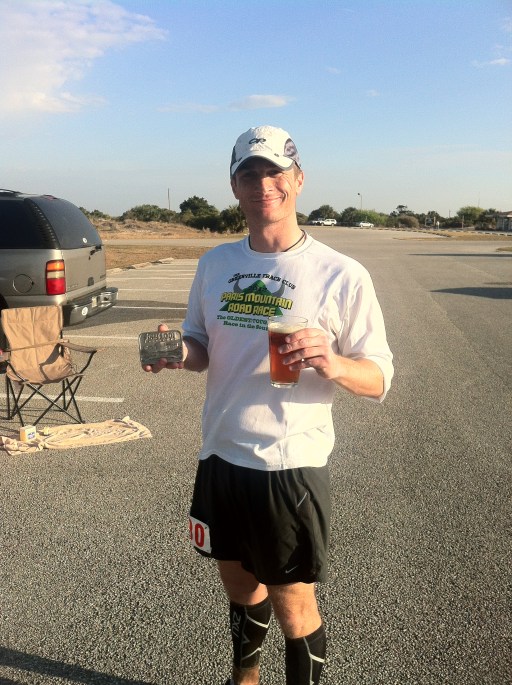 Josh with his new buckle and Intuition Ale Works mug and finisher beer, the People's Pale Ale.